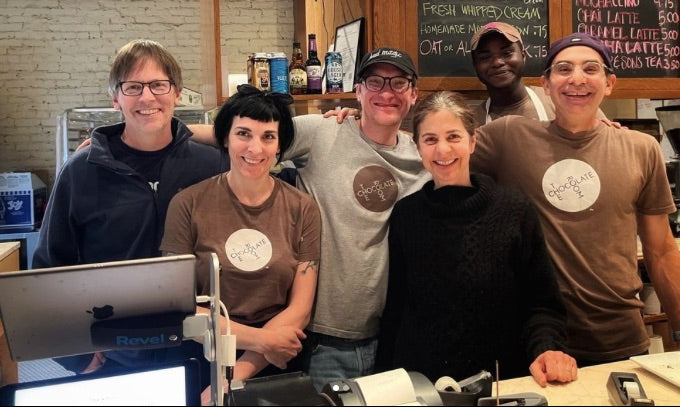 The happy staff behind the counter of The Chocolate Room